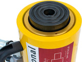 Yellow low-profile hydraulic cylinder with black piston head and side hydraulic hose connection on a white background.